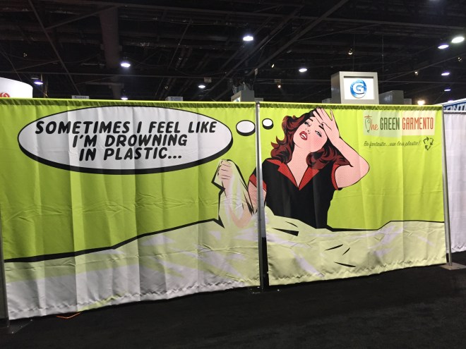 A large green banner depicting a women clutching plastic saying "sometimes I feel like I'm drowning in plastic."